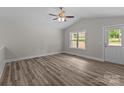Spacious living room with lots of natural light, ceiling fan and a door to the outside at 896 Oval St, Kannapolis, NC 28081