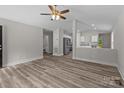 Open-concept living room featuring hardwood floors and a ceiling fan at 896 Oval St, Kannapolis, NC 28081