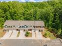 Overhead shot of lovely townhomes with driveways and grassy areas on a sunny day at 9203 Grand Valley Dr, Charlotte, NC 28213