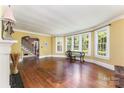Bright living room boasts hardwood floors, large windows, and an open layout with stylish design elements at 1139 S Belvedere Ave, Gastonia, NC 28054