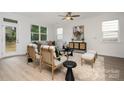 Bright living room featuring modern furniture and large windows at 12744 Susanna Dr, Charlotte, NC 28214
