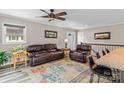 Comfortable living area featuring leather furniture, neutral walls, and a ceiling fan at 147 Bluewing Ln # 274, Mooresville, NC 28117