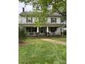 Charming two-story home with a large front porch at 208 E Main St, Cleveland, NC 27013