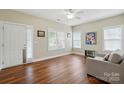 Bright living room featuring hardwood floors, neutral paint, and abundant natural light at 2323 Granville Pl # A, Monroe, NC 28110