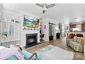 Comfortable living room with fireplace, TV, and desk area and an open floor plan at 2485 Shanklin Ln, Denver, NC 28037
