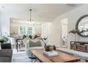 Open-concept living space, showing the light fixtures and view of the kitchen and bathroom at 318 Sixth St, Belmont, NC 28012