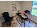 Inviting home office with modern desk, stylish seating, and bright natural light at 5010 Hemphill Rd, Gastonia, NC 28056