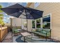 Relaxing back deck featuring comfortable outdoor seating and a large umbrella at 532 Dalkeith Ave, Rock Hill, SC 29732