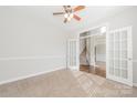 Bright room showcasing French doors, carpeted floors, and neutral decor at 10008 King George Ln, Waxhaw, NC 28173