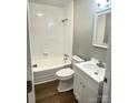 Well-lit bathroom with white tile, a shower-tub combo, and updated vanity for a clean aesthetic at 1052 S Grove Street Ext, Lincolnton, NC 28092
