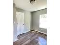 Inviting room featuring vinyl floors, a bright window, and neutral paint, creating a blank canvas at 1052 S Grove Street Ext, Lincolnton, NC 28092