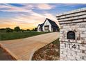Long driveway leading up to a stunning modern home with beautiful landscaping at 1141 Harper Lee Dr, Newton, NC 28658