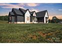 Well maintained two story home with a lush green lawn in a quiet neighborhood at 1141 Harper Lee Dr, Newton, NC 28658