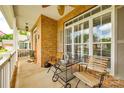 Cozy front porch seating area with a table, chairs, and view of the neighborhood at 1655 Essex Hall Dr, Rock Hill, SC 29730