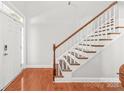 Bright foyer showcases a staircase with wooden handrail and white spindles at 2441 Chatham Dr, Fort Mill, SC 29707