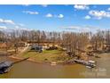 Overhead shot capturing the property's extensive landscaping, lake access, and private docks at 3062 Bass Dr, Sherrills Ford, NC 28673