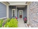 Charming front porch with decorative door, stone accents, and space for seating at 3537 Plum St, Fort Mill, SC 29715