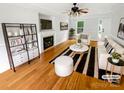 Bright living room with hardwood floors, fireplace, and modern furnishings at 3600 Sipes Ln, Charlotte, NC 28269
