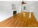 Bright living room with hardwood floors and fireplace at 3600 Sipes Ln, Charlotte, NC 28269