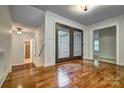 Inviting foyer with hardwood floors and elegant glass double doors at 46 Timberidge Dr, Lake Wylie, SC 29710