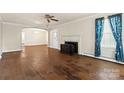 Inviting living room featuring hardwood floors and a fireplace centerpiece at 4608 Beatties Ford Rd, Charlotte, NC 28216