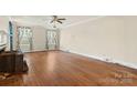 Spacious living room featuring hardwood floors and abundant natural light at 4608 Beatties Ford Rd, Charlotte, NC 28216