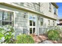 Close-up of the front door with sidelights, brick steps and detailed trim with fresh landscaping at 4738 Truscott Rd, Charlotte, NC 28226