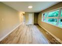 Open-concept living room with hard wood flooring, offering plenty of space and natural light at 509 North St, Belmont, NC 28012