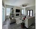 Inviting living room featuring a stylish fireplace, comfortable seating, and elegant decor at 5118 Regents Park Dr, Hickory, NC 28602
