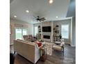 Spacious living room features a stone fireplace, modern furnishings, and plenty of natural light at 5118 Regents Park Dr, Hickory, NC 28602