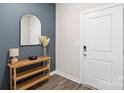 Modern entryway with stylish console table, decorative mirror, and neutral color palette at 518 Tayberry Ln, Fort Mill, SC 29715