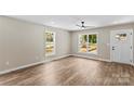 Bright living room with wood floors, neutral walls, and natural lighting at 630 W Bell St, Statesville, NC 28677