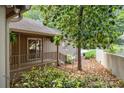 Home exterior with a covered porch and lush greenery, offering a serene and private outdoor space at 7 Turtle Ln, Clover, SC 29710