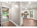 Bright kitchen view from hallway, showcasing white cabinetry and stainless steel appliances at 7 Turtle Ln, Clover, SC 29710
