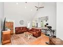 Bright, open living room with hardwood floors and ceiling fan at 7328 S Providence Rd, Waxhaw, NC 28173