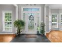 Bright foyer with hardwood floors, transom windows, and decorative accents creating a warm welcome at 1498 Farrow Dr, Rock Hill, SC 29732