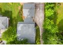 A top-down shot showcases the house's roof, long driveway, and surrounding trees at 204 S Elm St, Cherryville, NC 28021