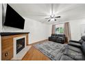 Bright living room with fireplace and a large window at 2117 Seabrook Ln, Fort Mill, SC 29715