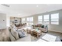 Spacious living area with large windows, seamlessly connected to the dining area and kitchen at 2636 Tillman St, Monroe, NC 28112