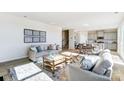 Open-concept living room flows into dining and kitchen with lots of seating at 2636 Tillman St, Monroe, NC 28112