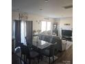 A dining room that transitions to the living room, featuring modern decor, ample seating, and natural light at 324 Gaines Rd # 8, Clover, SC 29710