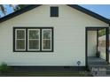 Home showcasing siding and black trim, offering curb appeal and a touch of modern elegance at 443 Brandon St, Davidson, NC 28036