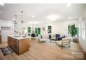 Bright and airy living room featuring an open floor plan, modern decor, and hardwood floors at 4547 Kings Ct, Hickory, NC 28602