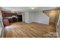 Spacious living room featuring wood flooring and an open layout at 5823 Natick Dr, Charlotte, NC 28214