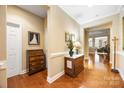 Elegant hallway with hardwood floors, decorative molding, and transitional furnishings at 611 Tee Ridge Ct, Fort Mill, SC 29715