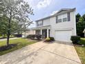 Well-maintained two-story home with a nicely landscaped front yard and a driveway at 815 Fescue Ct, Charlotte, NC 28216