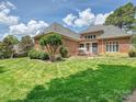 Spacious backyard featuring a well-maintained lawn, patio area perfect for outdoor gatherings at 11321 James Jack Ln, Charlotte, NC 28277