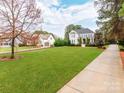 Spacious front yard with a well-maintained lawn and a view of the beautiful two-story home at 123 Yellow Jacket Cir, Mooresville, NC 28117