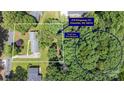 Aerial view of the property showcasing its location, backyard pond view, and proximity to surrounding area at 218 Kingsway Cir, Charlotte, NC 28214