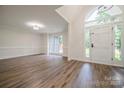Bright living room with hardwood floors, large windows, and a welcoming entrance at 26056 Neptunes Lndg, Fort Mill, SC 29708